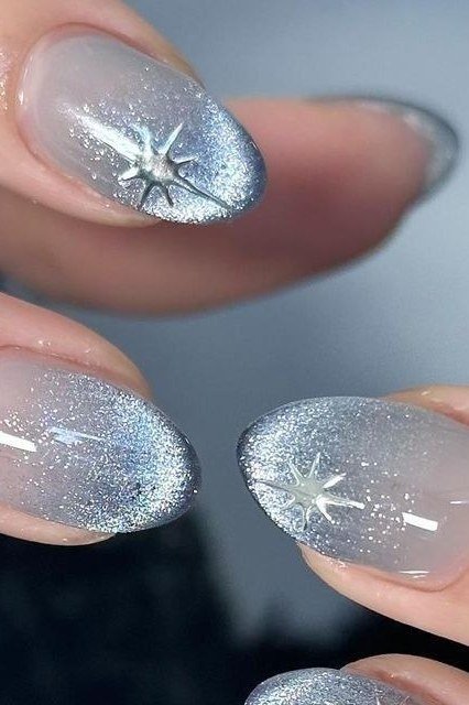 Silver cat-eye nails with starburst art for women over 50
