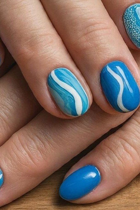 Turquoise glitter nails on mature hands for women over 50