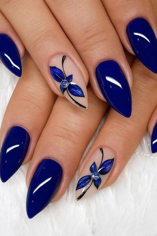 Royal blue almond nails with blue butterfly art for women over 50