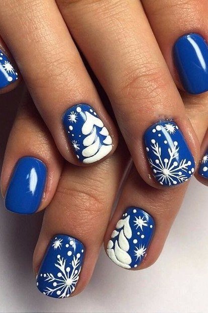 Royal blue nails with white winter nail art for women over 50
