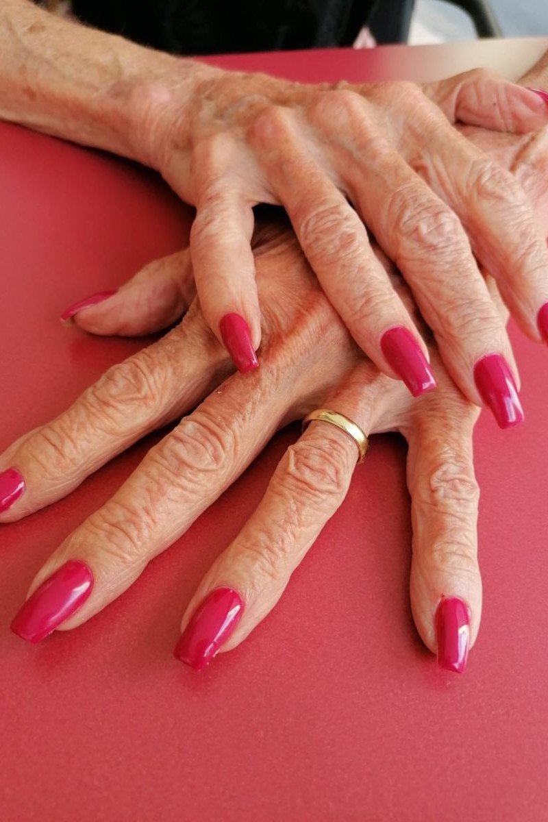 Soft Pink Glossy Nails - flattering nail color for women over 70 on mature hands