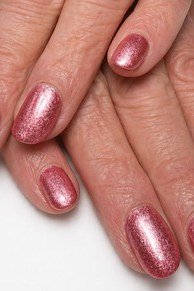 Classic Red Nails on Blue Sweater - flattering nail color for women over 70 on mature hands