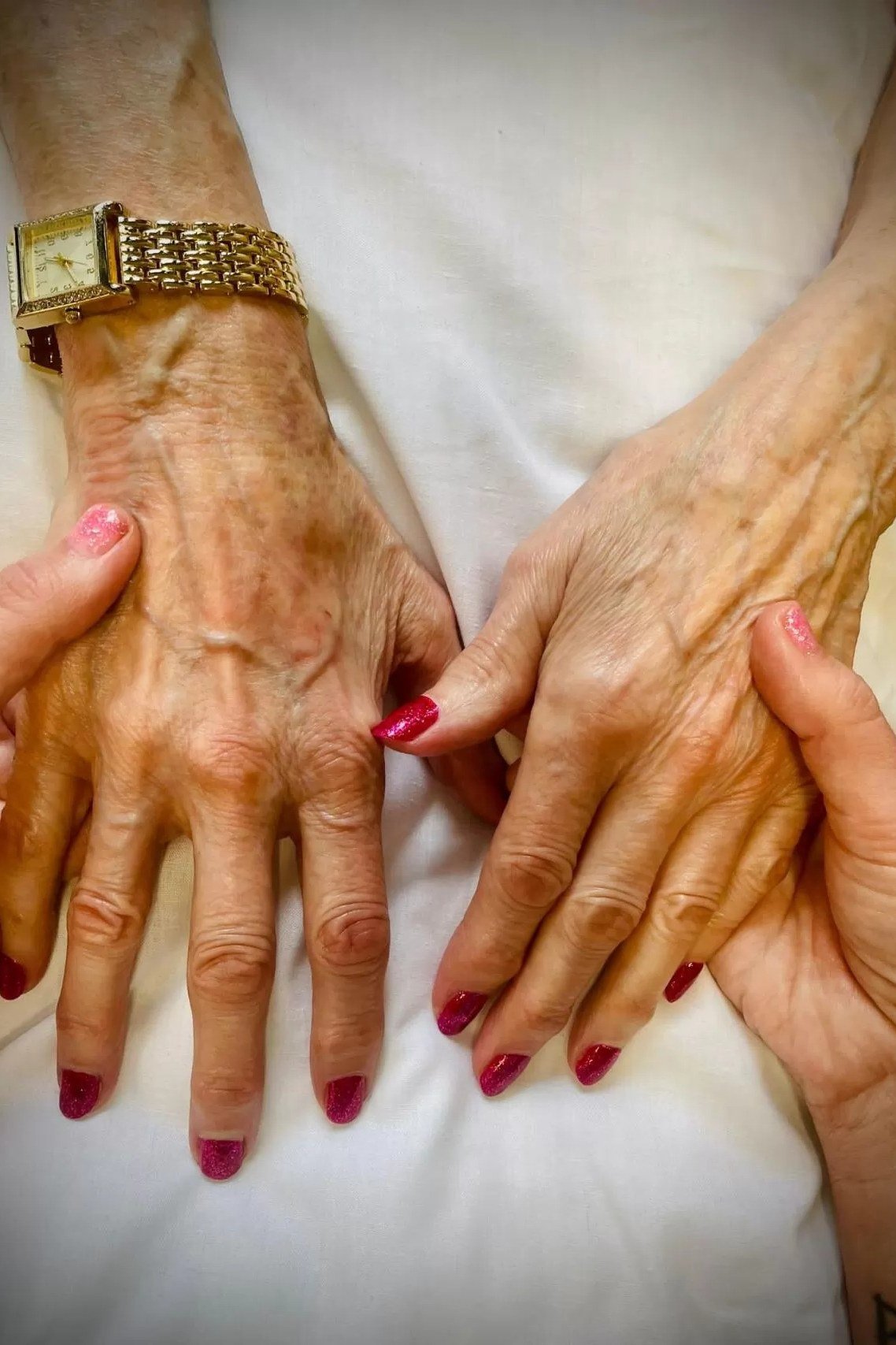 Hot Pink Glossy Nails - flattering nail color for women over 70 on mature hands