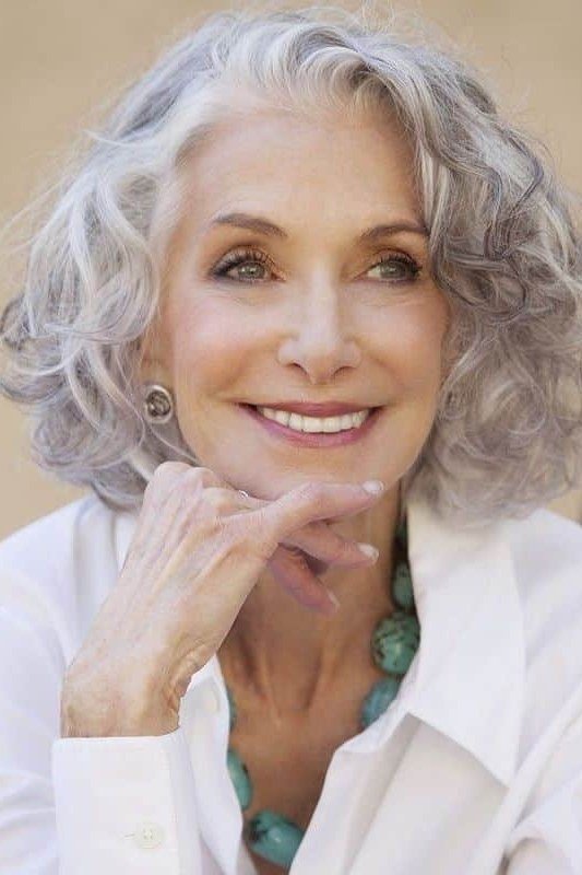 Silver curly chin length bob hairstyle for women over 60
