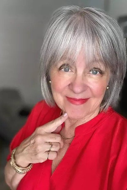 Silver bob with full straight across fringe for women over 60