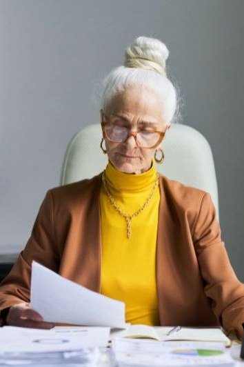 Mustard Turtleneck with a Brown Blazer - business outfit idea for women over 50