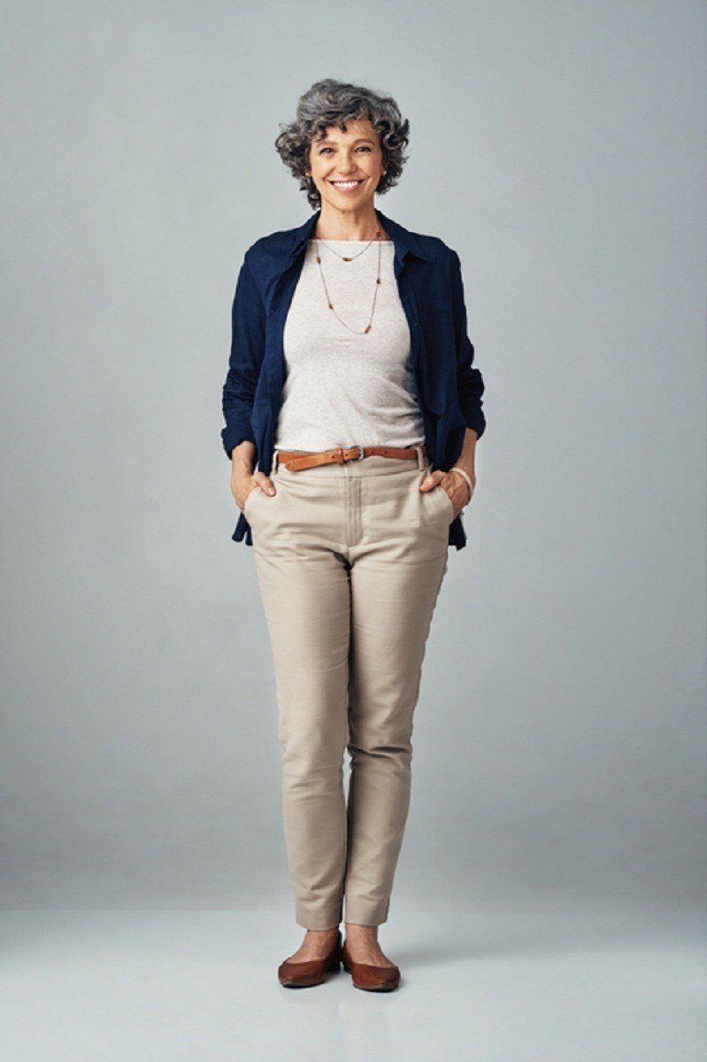 Navy Blazer with Beige Trousers in Studio - business outfit idea for women over 50