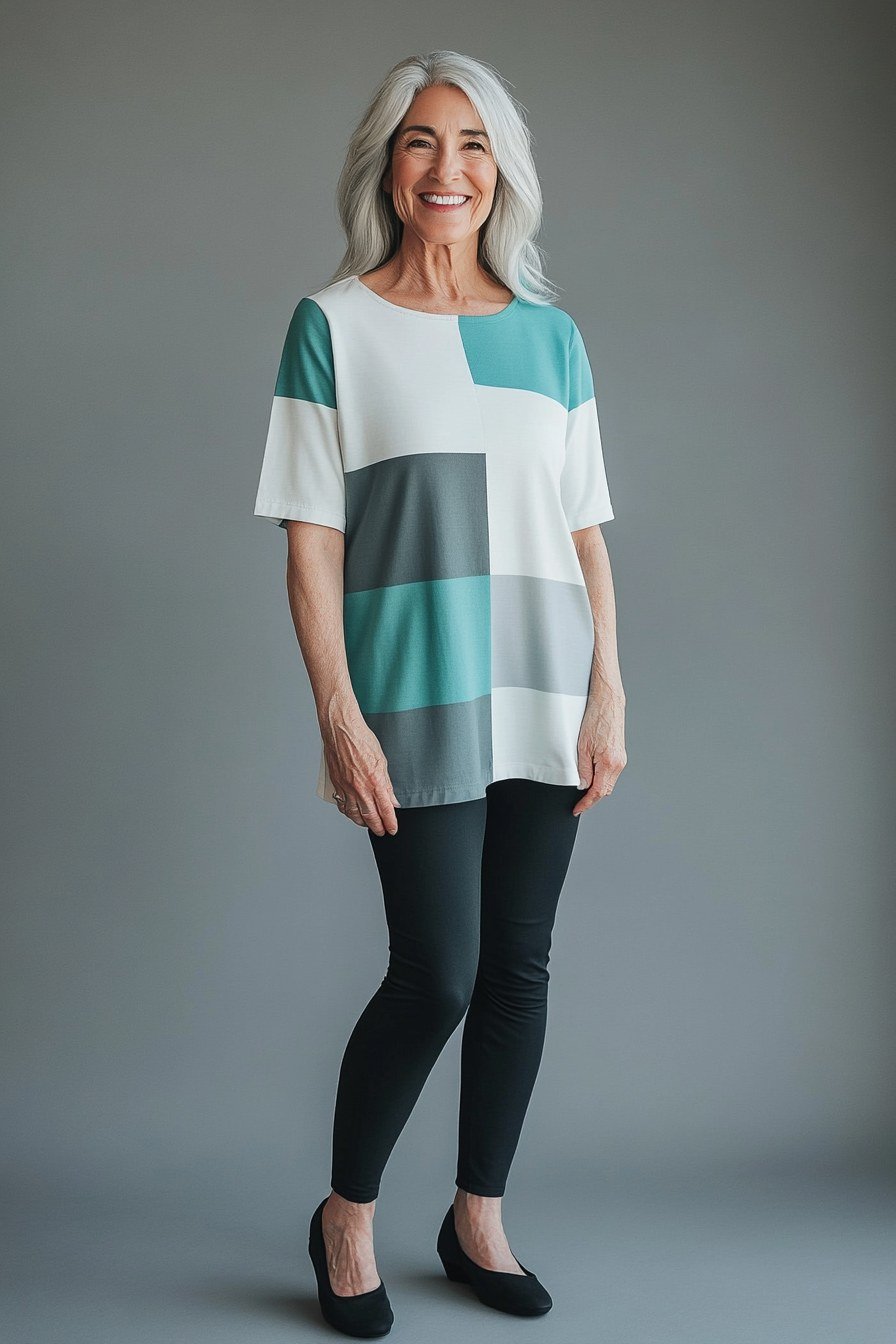 Teal/white/gray color-block tunic, black leggings, black flats, casual outfit for women over 50