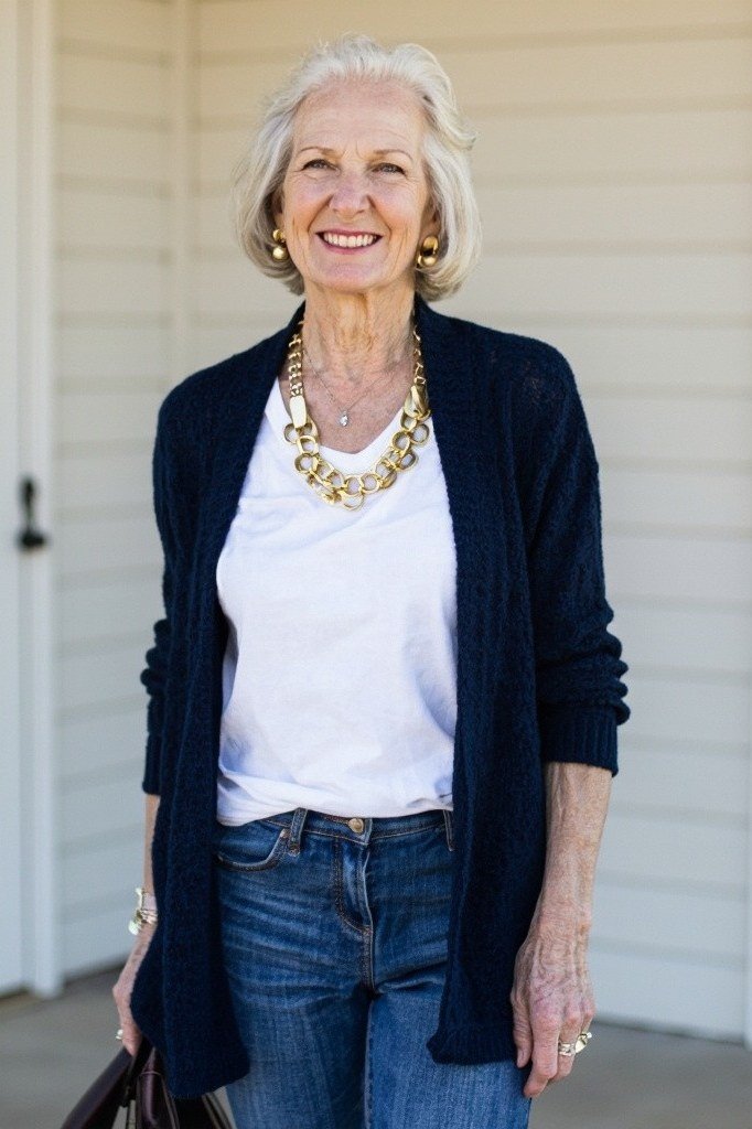 Navy cardigan, white tee, medium-wash jeans, gold necklace, casual outfit for women over 50