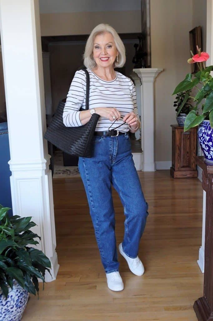 Gray/white striped tee, jeans, black tote, casual outfit for women over 50