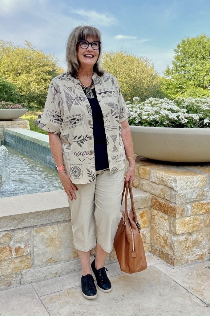Patterned shirt, khaki capris, brown tote, casual outfit for women over 50