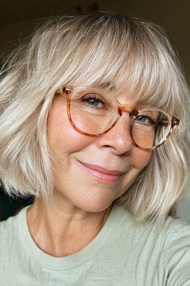 platinum layered bob with full bangs and glasses, front view - layered bob curtain bangs over 50, idea 10