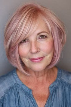 rose-tinted layered bob with bangs, front view - layered bob curtain bangs over 50, idea 19