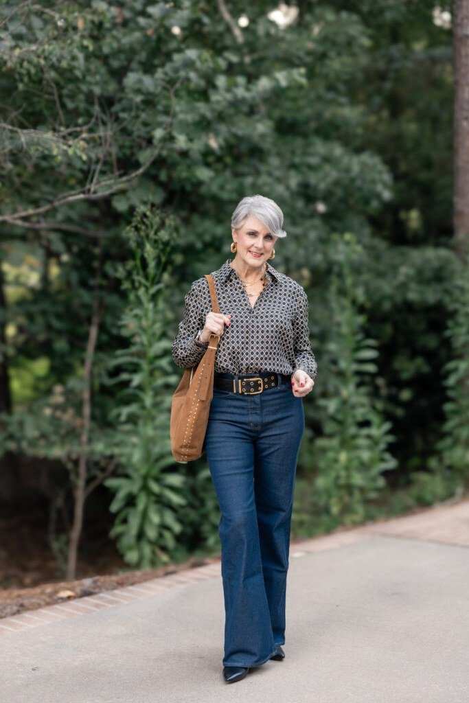 Gray Patterned Top with Blue Jeans and Tan Bag - classy fall outfit idea for women over 50