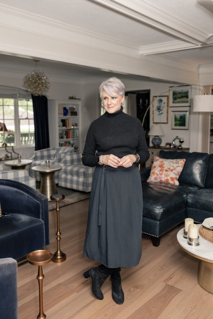 Black Top with Gray Pleated Skirt and Ankle Boots - classy fall outfit idea for women over 50