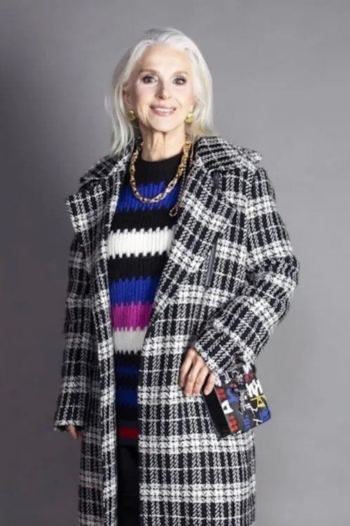 Plaid Coat with Striped Sweater in the Studio - classy fall outfit idea for women over 50