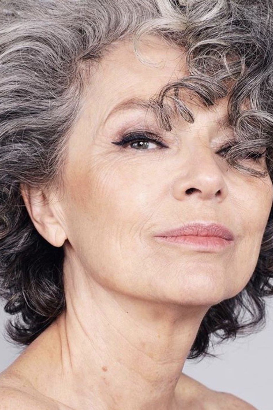Salt-and-pepper curly bob for women over 70