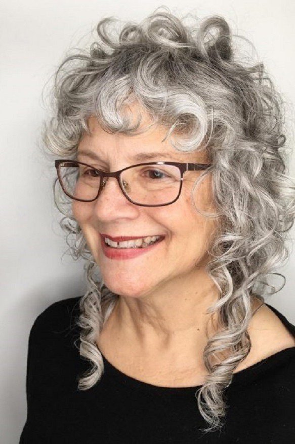 Grey curly bob with glasses for women over 70