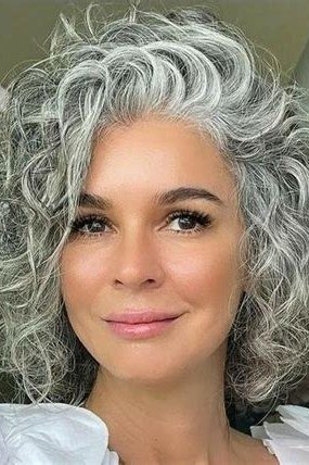 Polished silver curly bob for women over 70