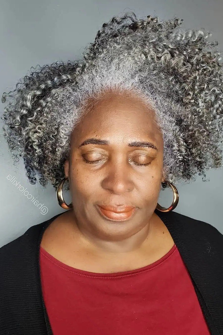 Silver coily natural hair for Black women over 70