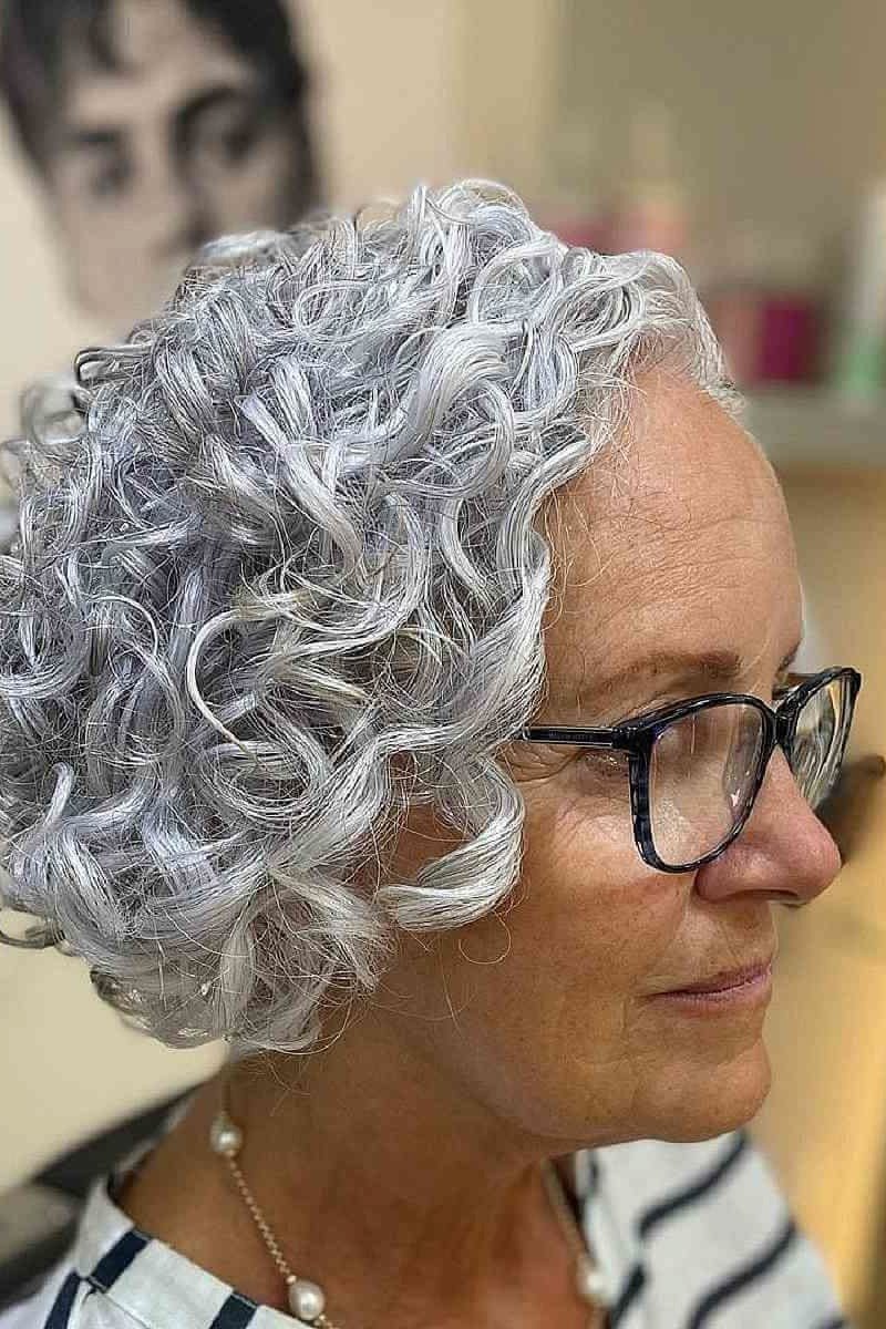 Chic silver curly bob with glasses for women over 70