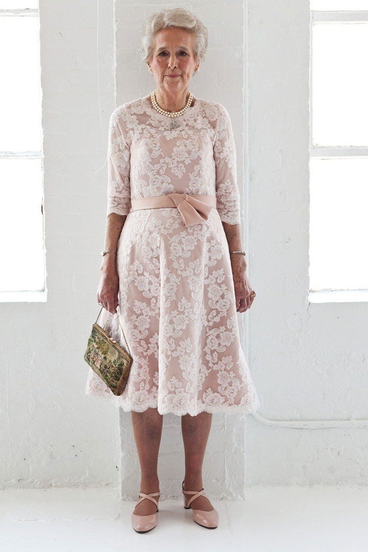 church dresses for women over 60: older woman in blush pink lace midi dress