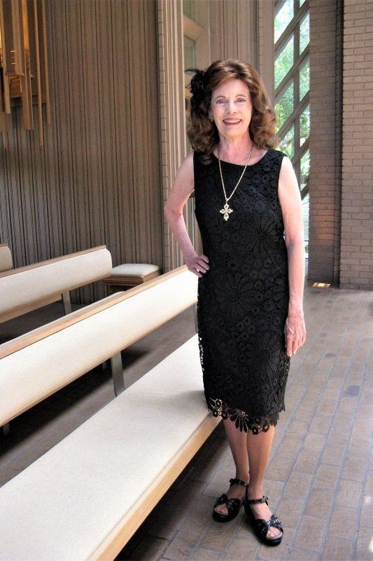 church dresses for women over 60: older woman in black lace midi dress with evening polish