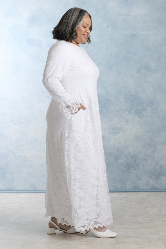 church dresses for women over 60: older woman in white lace maxi dress for special occasions