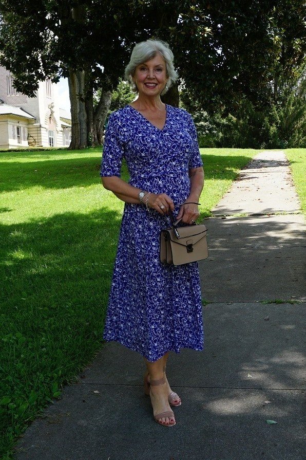 church dresses for women over 60: older woman in royal blue floral midi dress