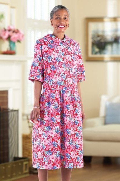church dresses for women over 60: older woman in bright pink mini floral midi