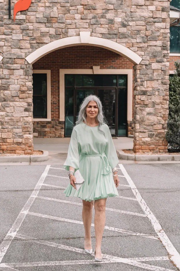 church dresses for women over 60: older woman in mint belted dress with kimono sleeves