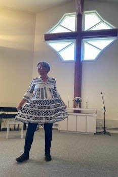 church dresses for women over 60: older woman in black and white chevron swing dress