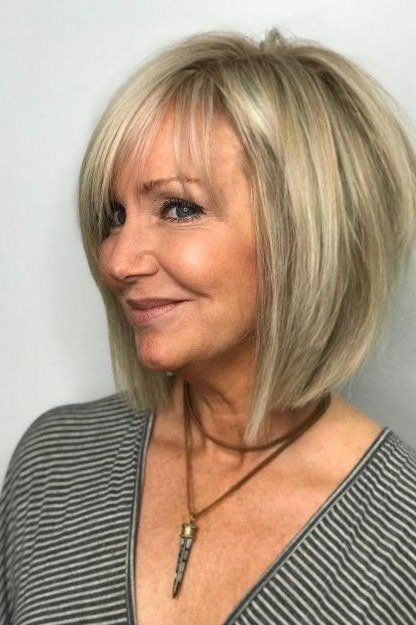 Blonde Choppy Bob With Side-Swept Layers, a choppy hairstyle for women over 50