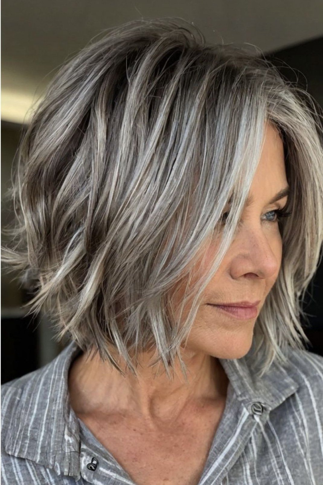 Silver choppy bob with curtain layers for older women