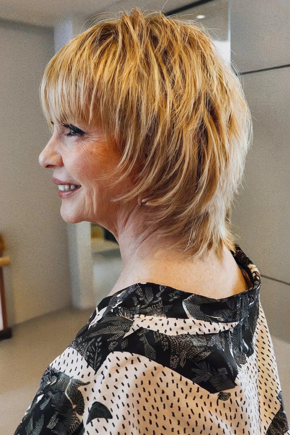 Blonde choppy bob with blowout volume for women over 70
