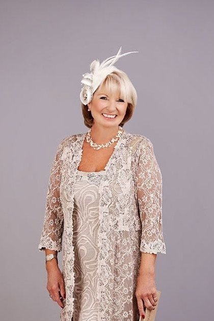 Champagne lace dress with fascinator, studio for women over 60