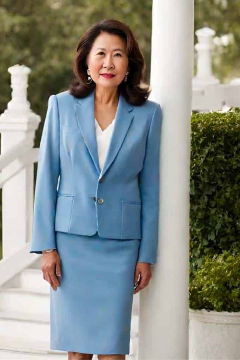 Light blue skirt suit, white porch for women over 60