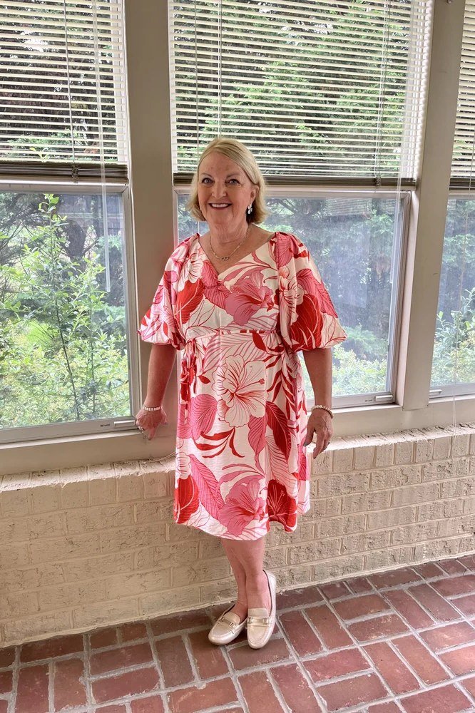 Pink floral midi dress, brick window for women over 60