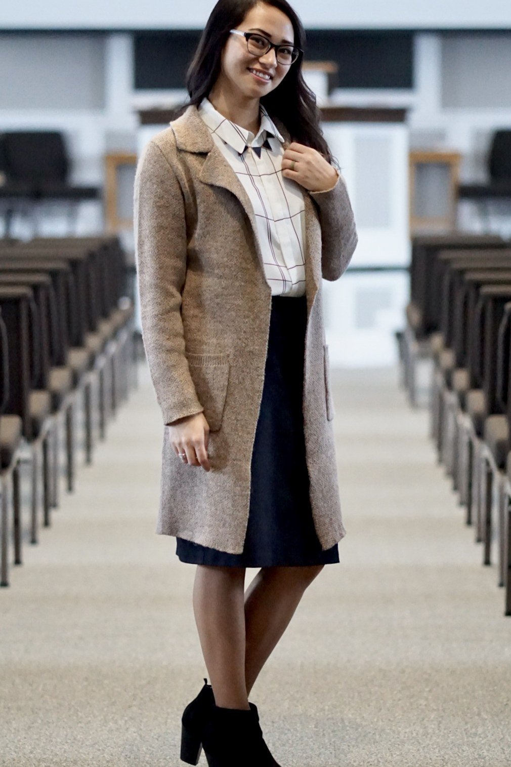 Beige long coat with navy dress, church aisle for women over 60