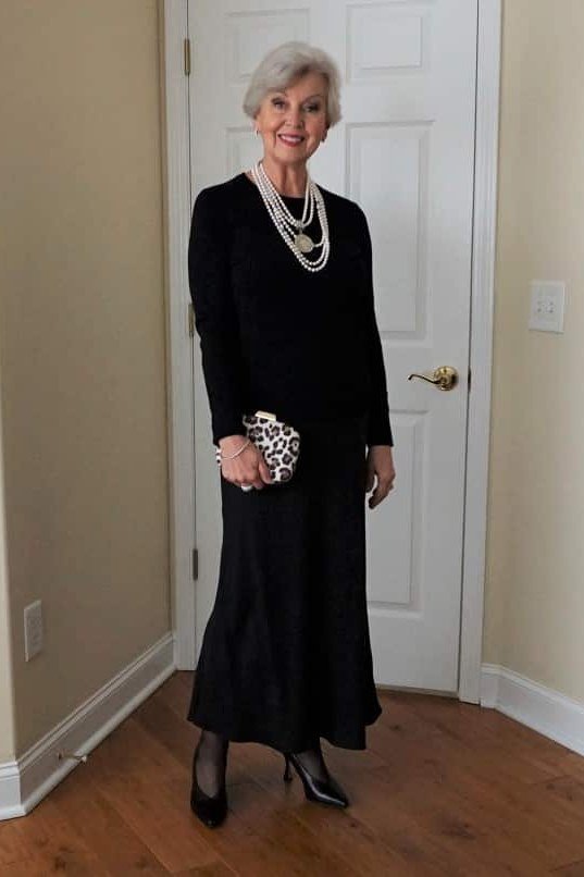 Black long dress with pearls with clutch, doorway for women over 60