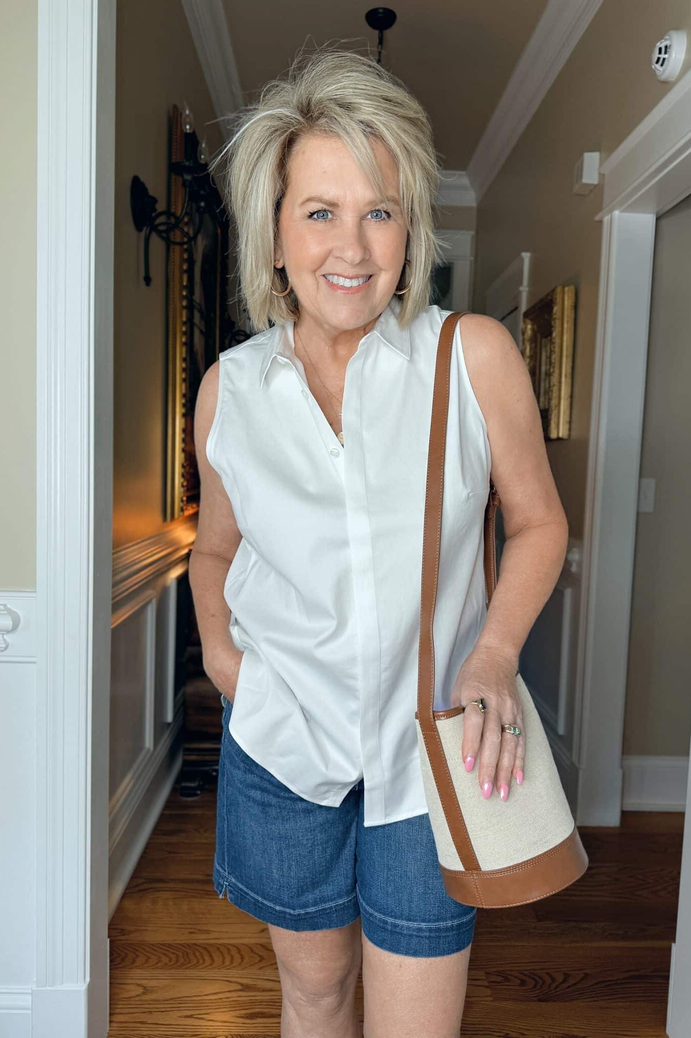 White Sleeveless Top With Denim Shorts - classy outfit idea for women over 50