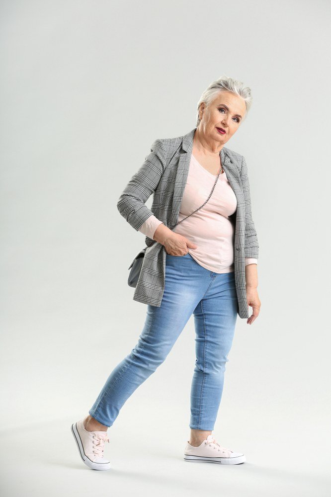 Gray blazer with pink top and jeans, smart casual outfit for women over 50