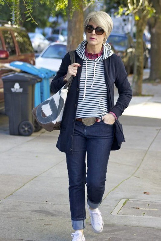 Striped hoodie with navy zip jacket and jeans, relaxed casual outfit for women over 50