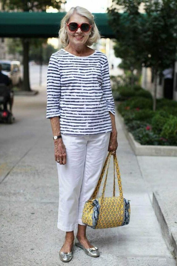 Navy striped top with white capris and straw bag, summer casual outfit for women over 50