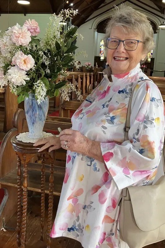 Pastel watercolor floral long sleeve dress, classy casual outfit idea for women over 60