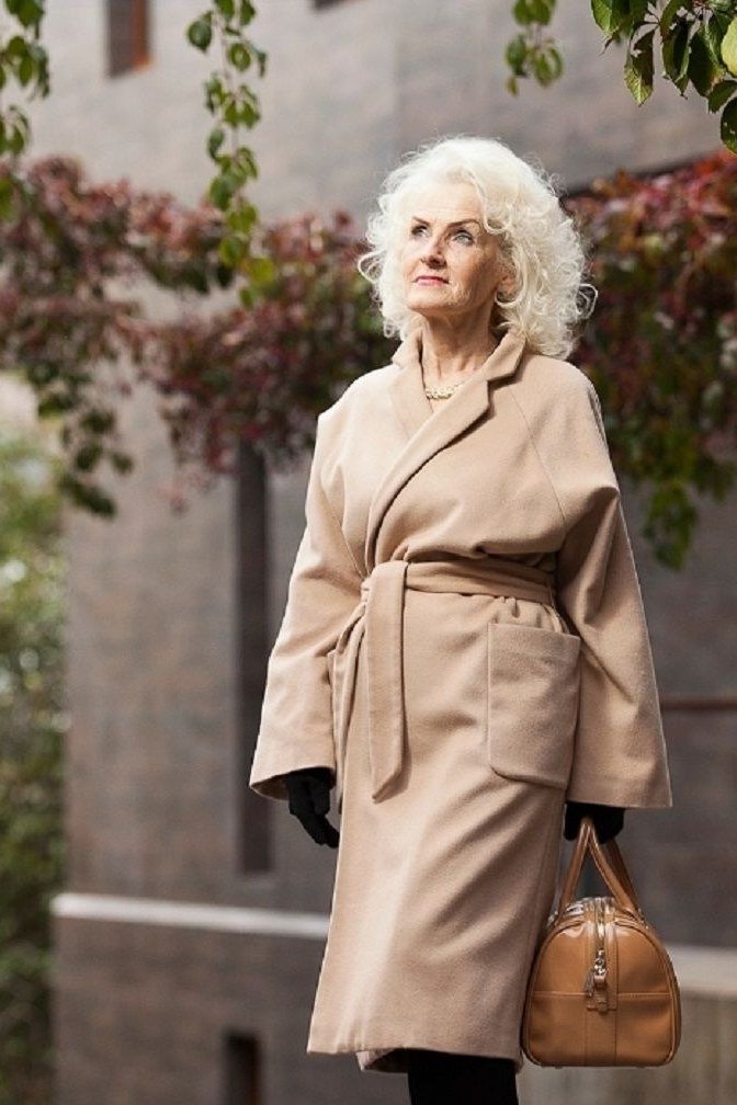 Beige wrap coat with tan top handle bag, classy casual outfit idea for women over 60
