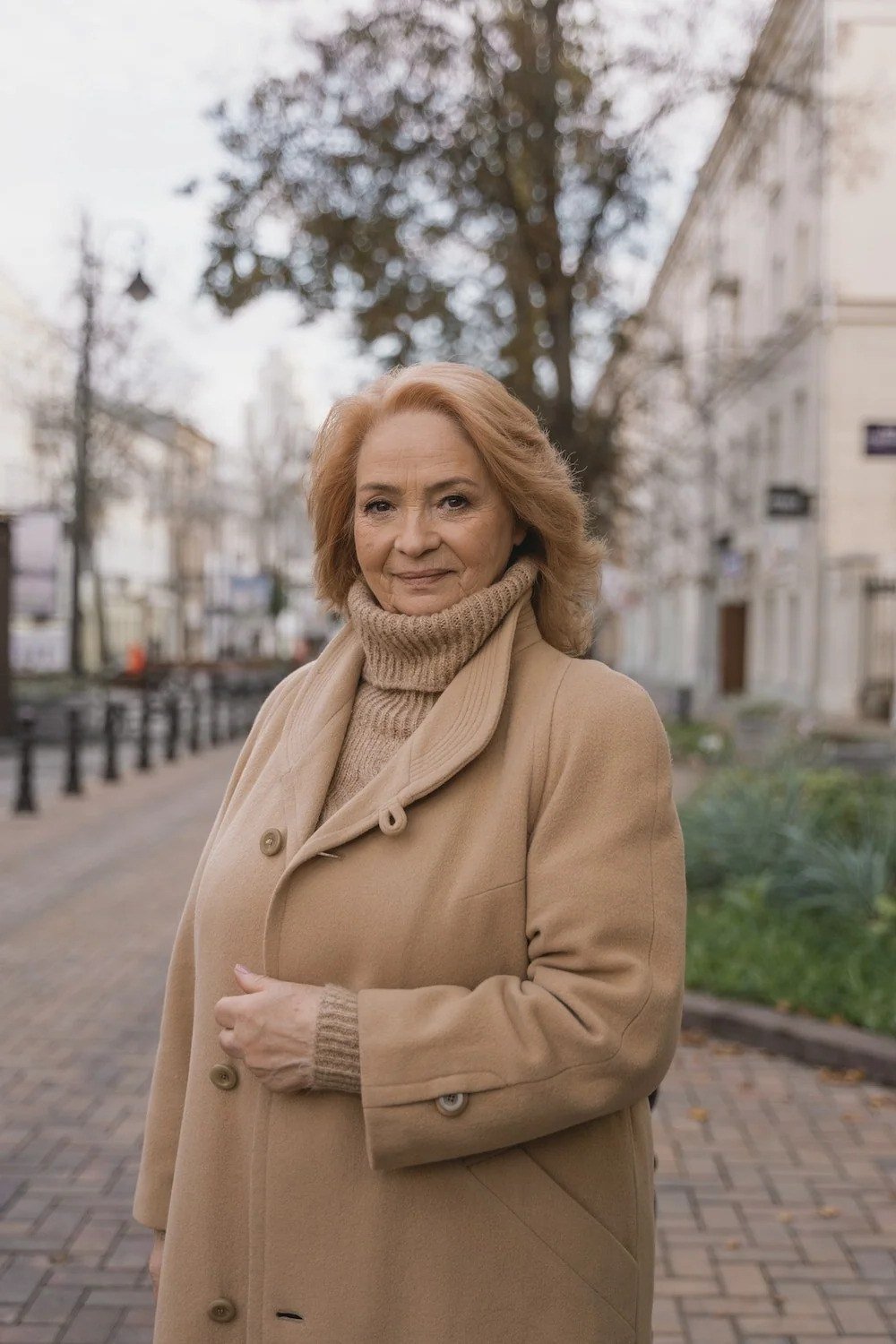 Camel coat over tan turtleneck, classy casual outfit idea for women over 60