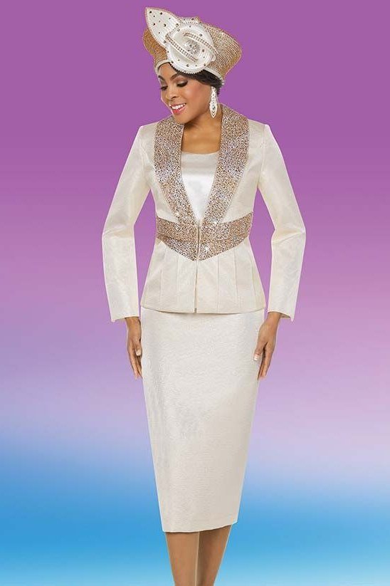 Older woman in white embellished skirt suit with hat