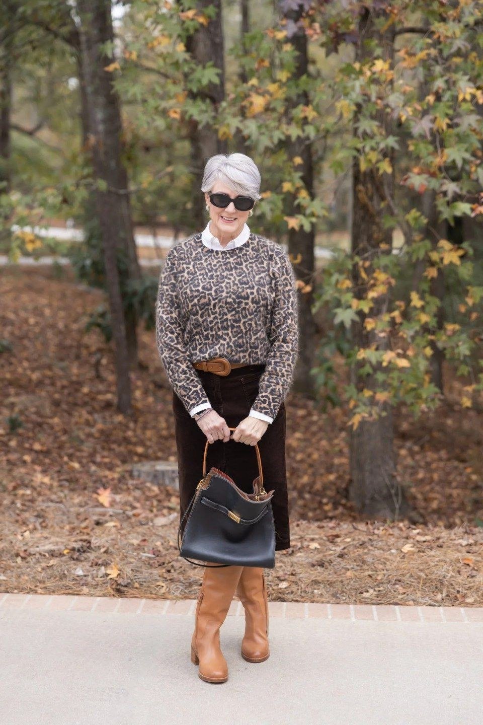 Patterned Sweater with Black Skirt and Tan Boots - corduroy outfit idea for women over 50