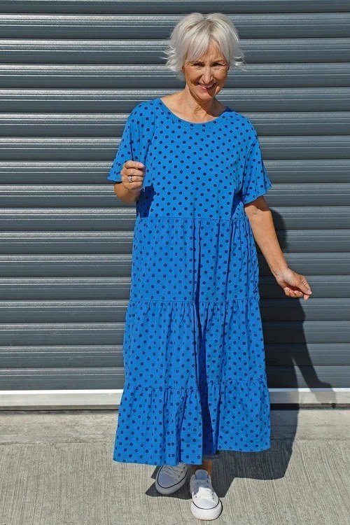 Cobalt blue polka dot tiered maxi dress with white sneakers